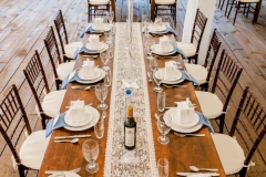 Farm tables with china place settings